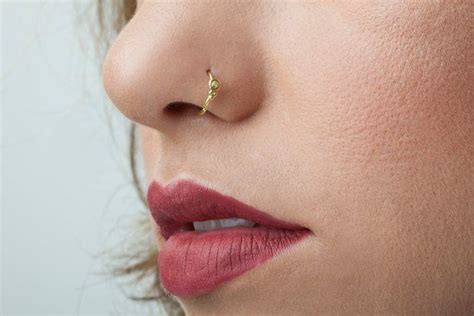 diamond piercing and tattoo|real diamond nose piercing.